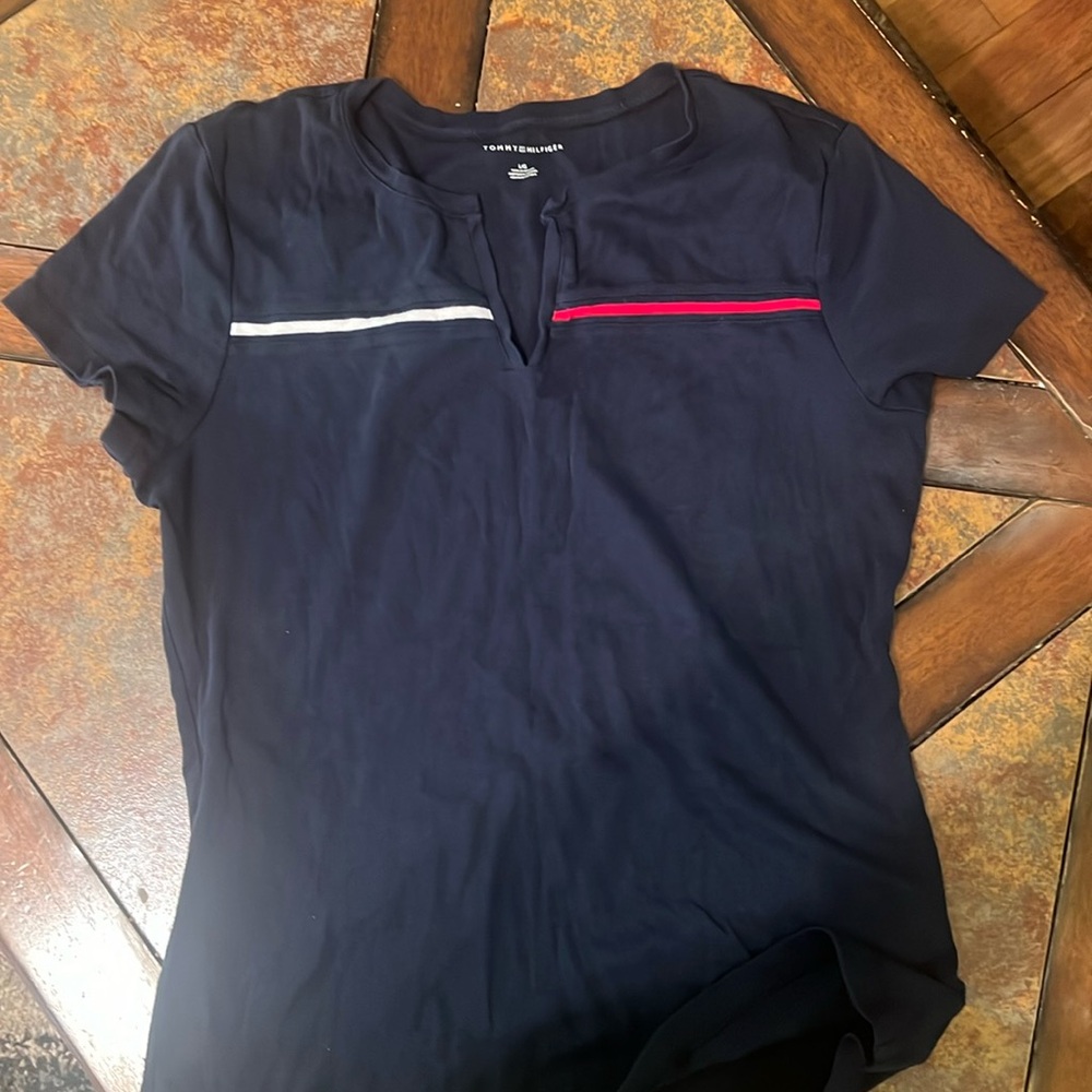 Used Tommy tee. Size ladies large. Cute V collar